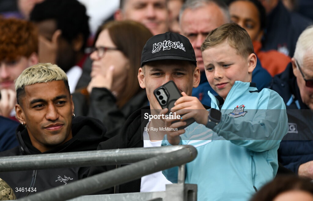 17 May 2026; Nine year old Louis Kelly takes a selfie with Leinster players Rieko Ioane and Sam Prendergast who were at the Leinster GAA Football Senior Championship final match between Dublin and Westmeath at Croke Park in Dublin. Photo by Ray McManus/Sportsfile