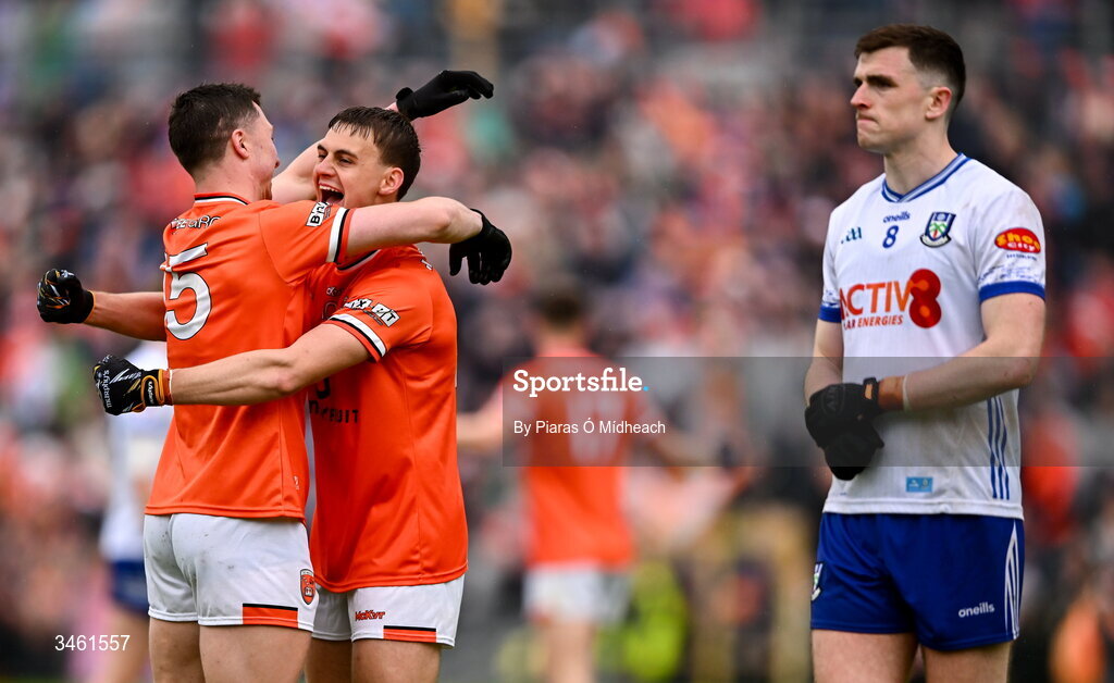 17 May 2026; Armagh players Oisin Conaty, left, and Darragh McMullan celebrate after their side's victory, as Míchéal McCarville of Monaghan walks by, after the Ulster GAA Football Senior Championship final match between Armagh and Monaghan at St Tiernach's Park in Clones, Monaghan. Photo by Piaras Ó Mídheach/Sportsfile