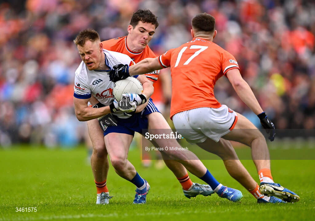 17 May 2026; Ryan McAnespie of Monaghan in action against Gareth Murphy, 17, and Jarly Óg Burns of Armagh during the Ulster GAA Football Senior Championship final match between Armagh and Monaghan at St Tiernach's Park in Clones, Monaghan. Photo by Piaras Ó Mídheach/Sportsfile