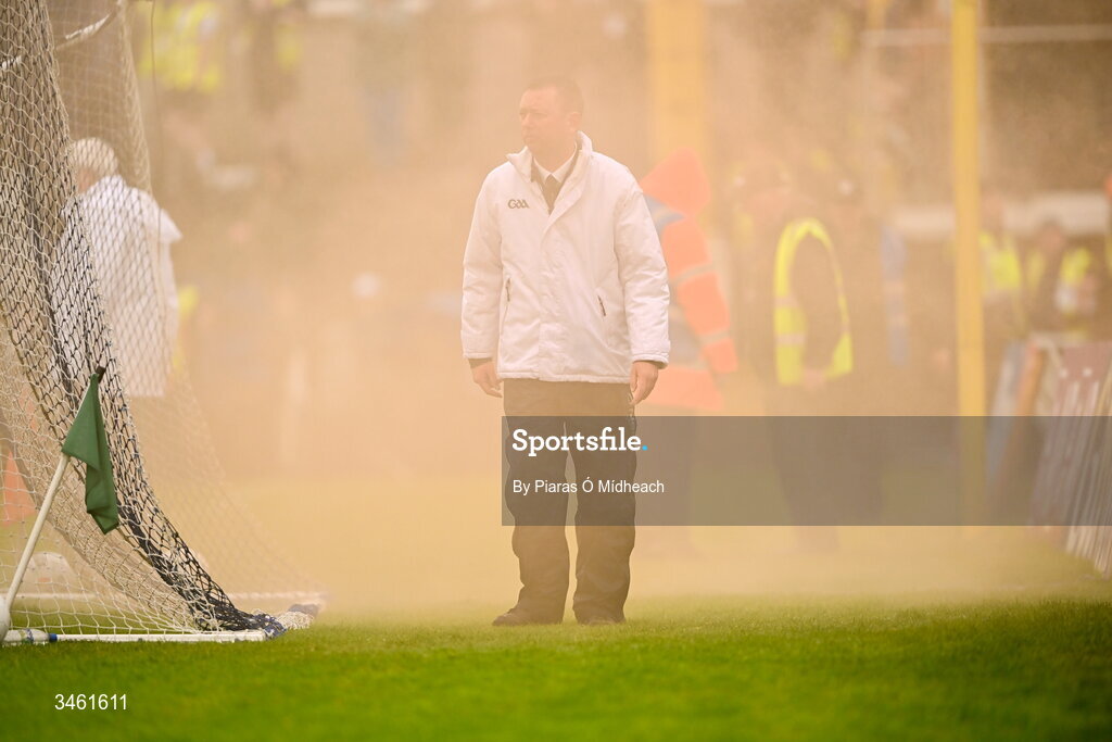 17 May 2026; An umpire stands next to his goal as flare smoke fills the air during the Ulster GAA Football Senior Championship final match between Armagh and Monaghan at St Tiernach's Park in Clones, Monaghan. Photo by Piaras Ó Mídheach/Sportsfile