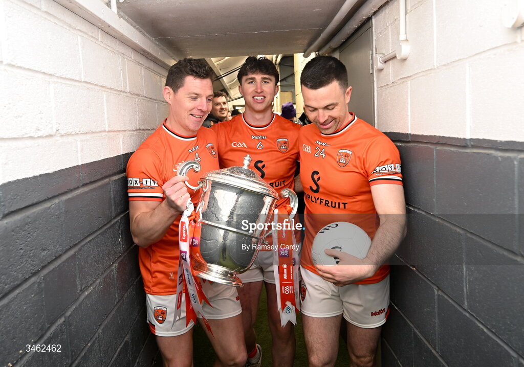 17 May 2026; Armagh players, from left, Paddy Burns, Tiernan Kelly and Aidan Forker with the Anglo Celt Cup after the Ulster GAA Football Senior Championship final match between Armagh and Monaghan at St Tiernach's Park in Clones, Monaghan. Photo by Ramsey Cardy/Sportsfile