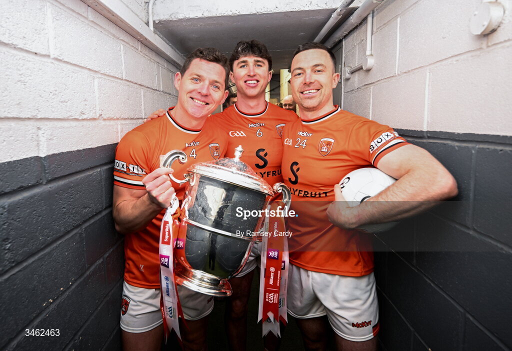 17 May 2026; Armagh players, from left, Paddy Burns, Tiernan Kelly and Aidan Forker with the Anglo Celt Cup after the Ulster GAA Football Senior Championship final match between Armagh and Monaghan at St Tiernach's Park in Clones, Monaghan. Photo by Ramsey Cardy/Sportsfile