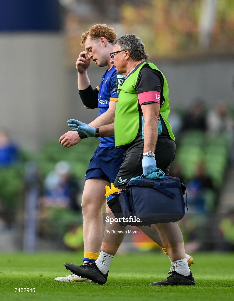 16 May 2026; Hugh Cooney of Leinster leaves the pitch with an injury, accompanied by Leinster head of medical Professor John Ryan during the United Rugby Championship match between Leinster and Ospreys at the Aviva Stadium in Dublin. Photo by Brendan Moran/Sportsfile