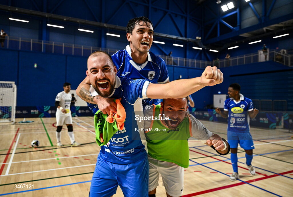 24 May 2026; Blue Magic players, from left, Gustavo Pereira da Silva, Leonardes Mattheus and goalkeeper Murillo Da Silva Vieira celebrate after the FAI Futsal Cup final match between Leinster Futsal and Blue Magic at the National Indoor Arena in Abbotstown, Dublin. Photo by Ben McShane/Sportsfile