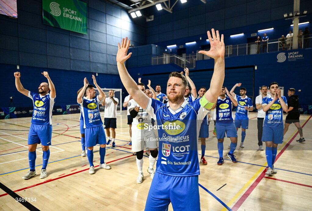24 May 2026; Blue Magic captain Ian Byrne celebrates with his teammates toward the supporters after the FAI Futsal Cup final match between Leinster Futsal and Blue Magic at the National Indoor Arena in Abbotstown, Dublin. Photo by Ben McShane/Sportsfile