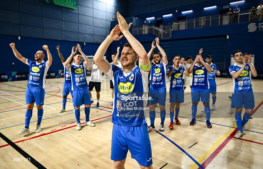 24 May 2026; Blue Magic captain Ian Byrne celebrates with his teammates toward the supporters after the FAI Futsal Cup final match between Leinster Futsal and Blue Magic at the National Indoor Arena in Abbotstown, Dublin. Photo by Ben McShane/Sportsfile