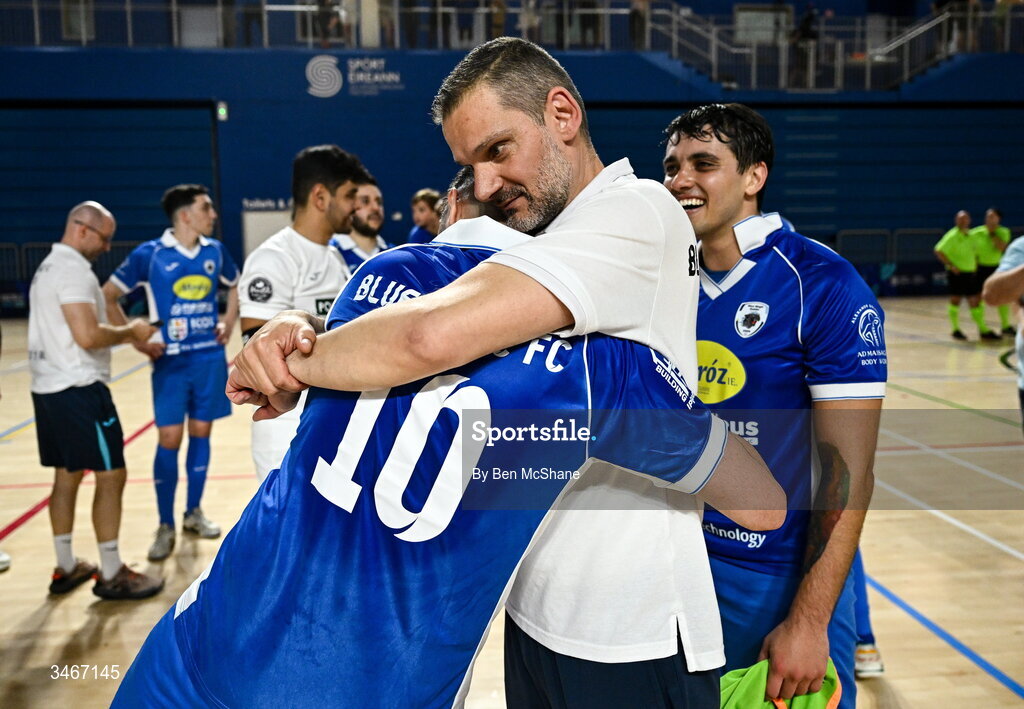 24 May 2026; Blue Magic head coach Sinisa Sicar, right, celebrates with Victor Calderon of Blue Magic after the FAI Futsal Cup final match between Leinster Futsal and Blue Magic at the National Indoor Arena in Abbotstown, Dublin. Photo by Ben McShane/Sportsfile