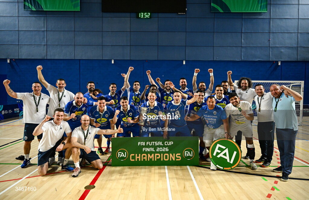 24 May 2026; Blue Magic players and staff celebrate with the cup after the FAI Futsal Cup final match between Leinster Futsal and Blue Magic at the National Indoor Arena in Abbotstown, Dublin. Photo by Ben McShane/Sportsfile