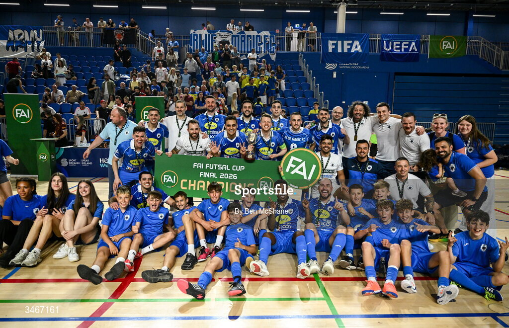 24 May 2026; Blue Magic players and staff celebrate with the cup after the FAI Futsal Cup final match between Leinster Futsal and Blue Magic at the National Indoor Arena in Abbotstown, Dublin. Photo by Ben McShane/Sportsfile