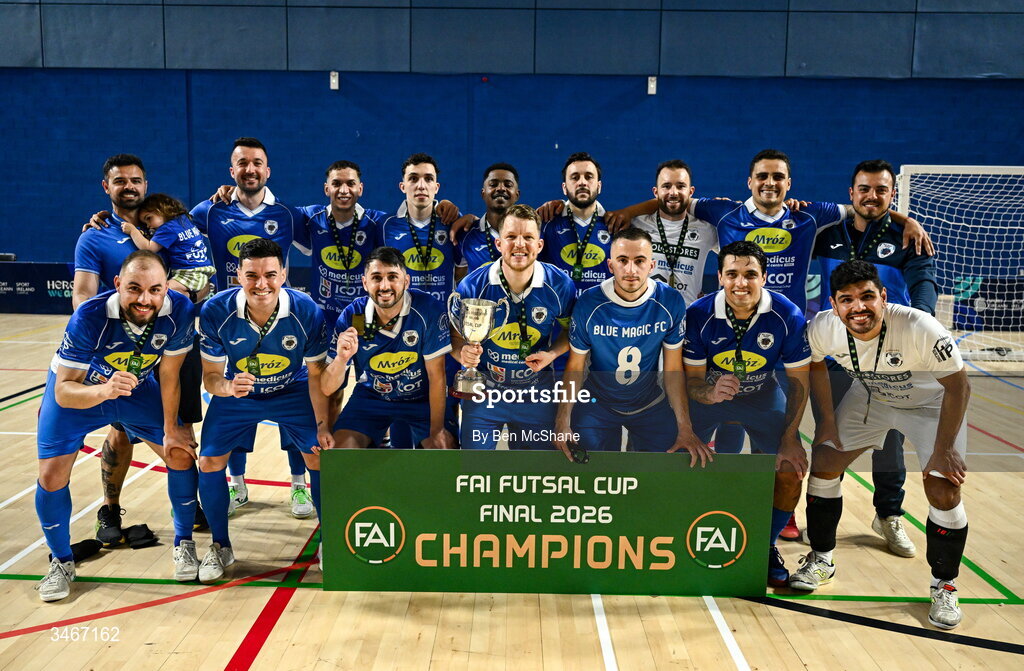 24 May 2026; Blue Magic players celebrate with the cup after the FAI Futsal Cup final match between Leinster Futsal and Blue Magic at the National Indoor Arena in Abbotstown, Dublin. Photo by Ben McShane/Sportsfile