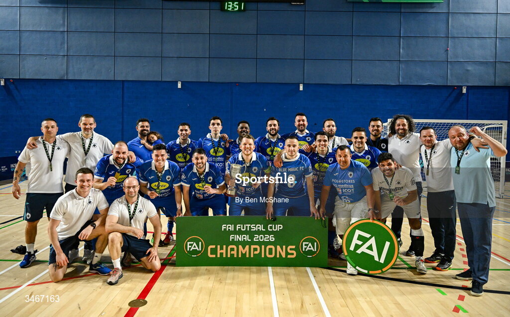 24 May 2026; Blue Magic players and staff celebrate with the cup after the FAI Futsal Cup final match between Leinster Futsal and Blue Magic at the National Indoor Arena in Abbotstown, Dublin. Photo by Ben McShane/Sportsfile