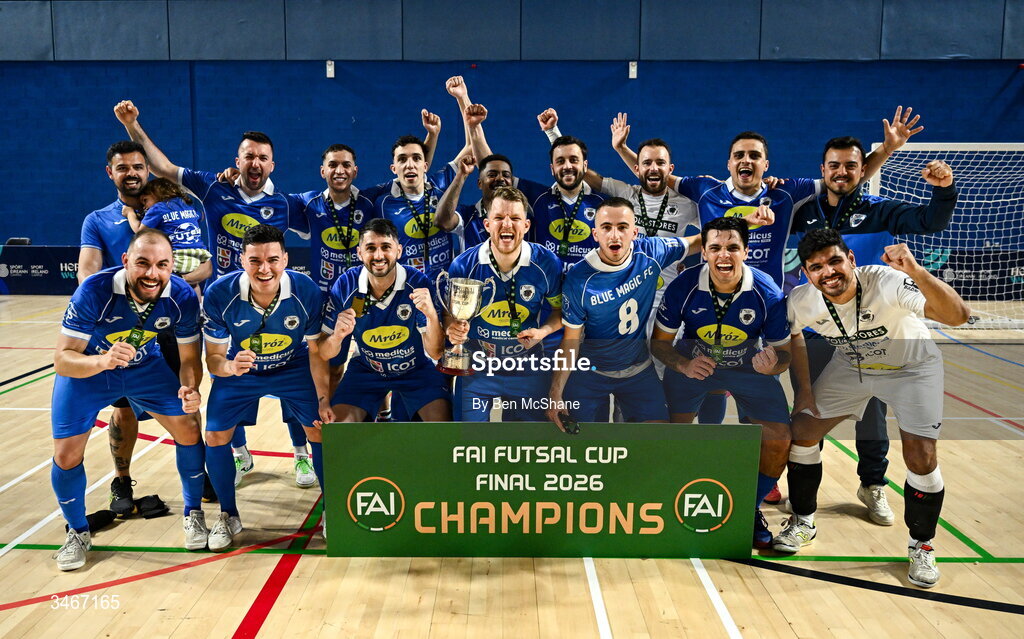 24 May 2026; Blue Magic players celebrate with the cup after the FAI Futsal Cup final match between Leinster Futsal and Blue Magic at the National Indoor Arena in Abbotstown, Dublin. Photo by Ben McShane/Sportsfile