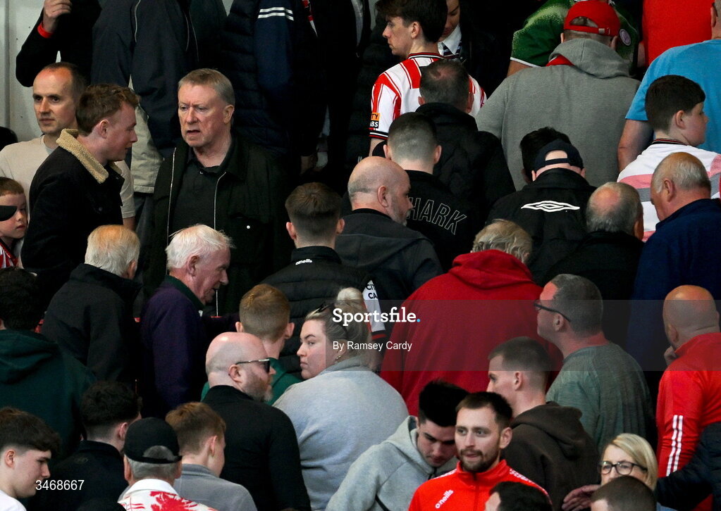 25 May 2026; Derry City chairman Philip O'Doherty watches on at the final whistle as supporters walk past in the SSE Airtricity Men’s Premier Division match between Derry City and Shelbourne at Find Insurance Celtic Park in Derry. Photo by Ramsey Cardy/Sportsfile