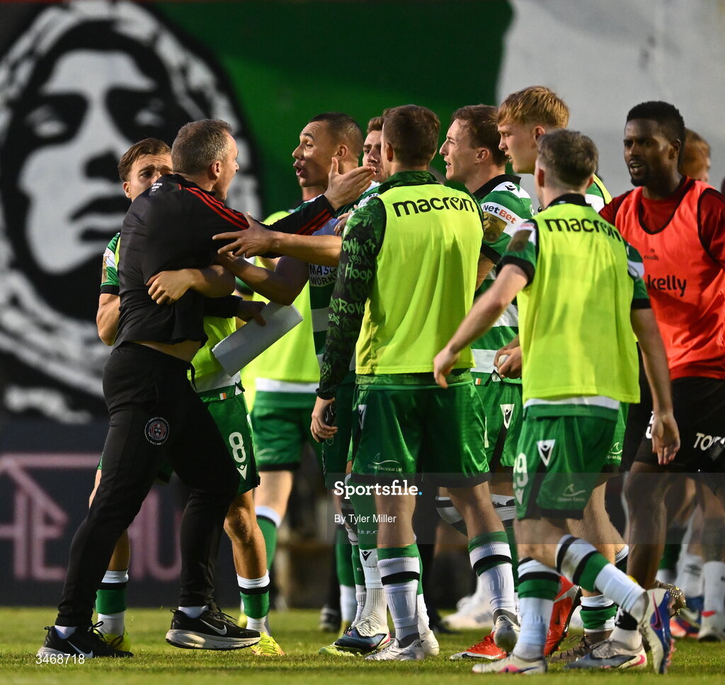 25 May 2026; Bohemians first team coach Derek Pender tussles wth Shamrock Rovers players after the SSE Airtricity Men’s Premier Division match between Bohemians and Shamrock Rovers at Dalymount Park in Dublin. Photo by Tyler Miller/Sportsfile