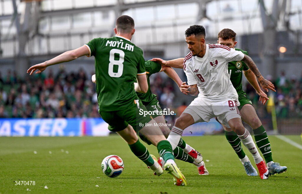 28 May 2026; Edmilson Junior of Qatar in action against Republic of Ireland players Jack Moylan, Liam Scales and Dara O'Shea during the international friendly match between Republic of Ireland and Qatar at the Aviva Stadium in Dublin. Photo by Ben McShane/Sportsfile