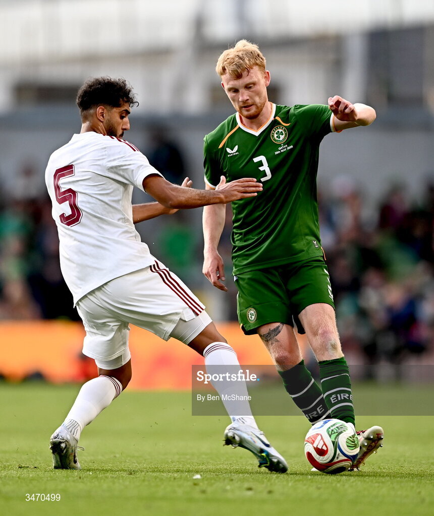 28 May 2026; Liam Scales of Republic of Ireland in action against Jassem Gaber of Qatar during the international friendly match between Republic of Ireland and Qatar at the Aviva Stadium in Dublin. Photo by Ben McShane/Sportsfile