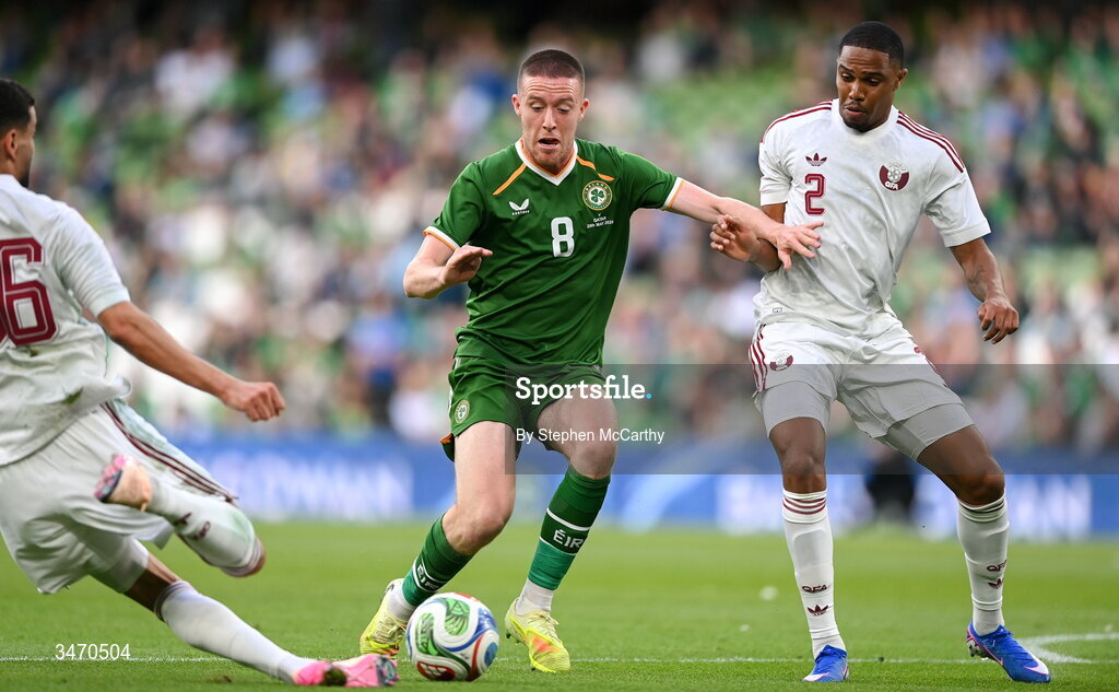 28 May 2026; Jack Moylan of Republic of Ireland in action against Qatar players Boualem Khoukhi, left, and Pedro Miguel during the international friendly match between Republic of Ireland and Qatar at the Aviva Stadium in Dublin. Photo by Stephen McCarthy/Sportsfile