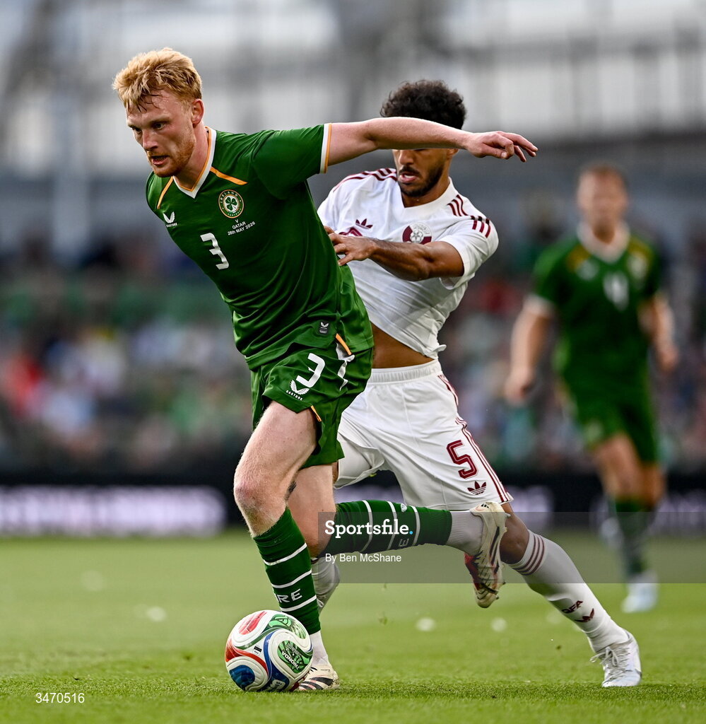 28 May 2026; Liam Scales of Republic of Ireland in action against Jassem Gaber of Qatar during the international friendly match between Republic of Ireland and Qatar at the Aviva Stadium in Dublin. Photo by Ben McShane/Sportsfile