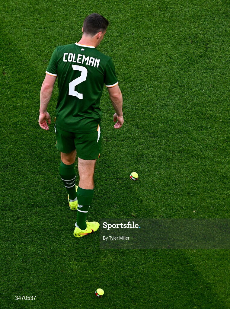 28 May 2026; Seamus Coleman of Republic of Ireland clears tennis balls from the pitch during the international friendly match between Republic of Ireland and Qatar at the Aviva Stadium in Dublin. Photo by Tyler Miller/Sportsfile
