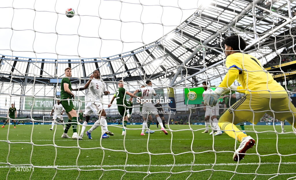 28 May 2026; Nathan Collins of Republic of Ireland scores his side's first goal, past Qatar goalkeeper Mahmoud Abunada, during the international friendly match between Republic of Ireland and Qatar at the Aviva Stadium in Dublin. Photo by Stephen McCarthy/Sportsfile