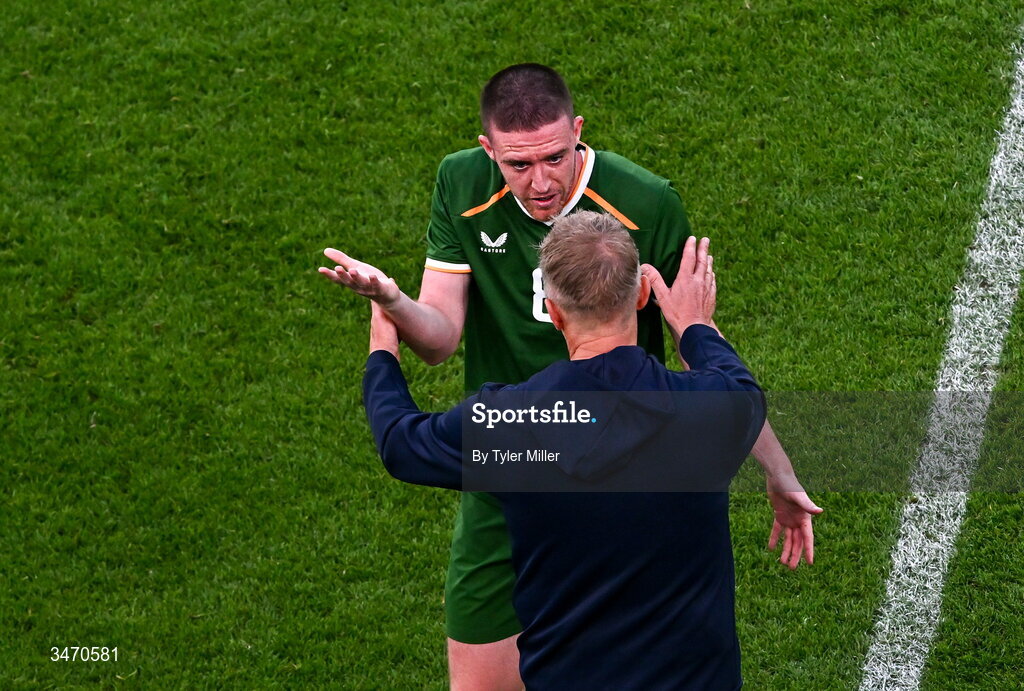 28 May 2026; Jack Moylan of Republic of Ireland is consoled by manager Heimir Hallgrimsson as he leaves the pitch after being shown a red card during the international friendly match between Republic of Ireland and Qatar at the Aviva Stadium in Dublin. Photo by Tyler Miller/Sportsfile