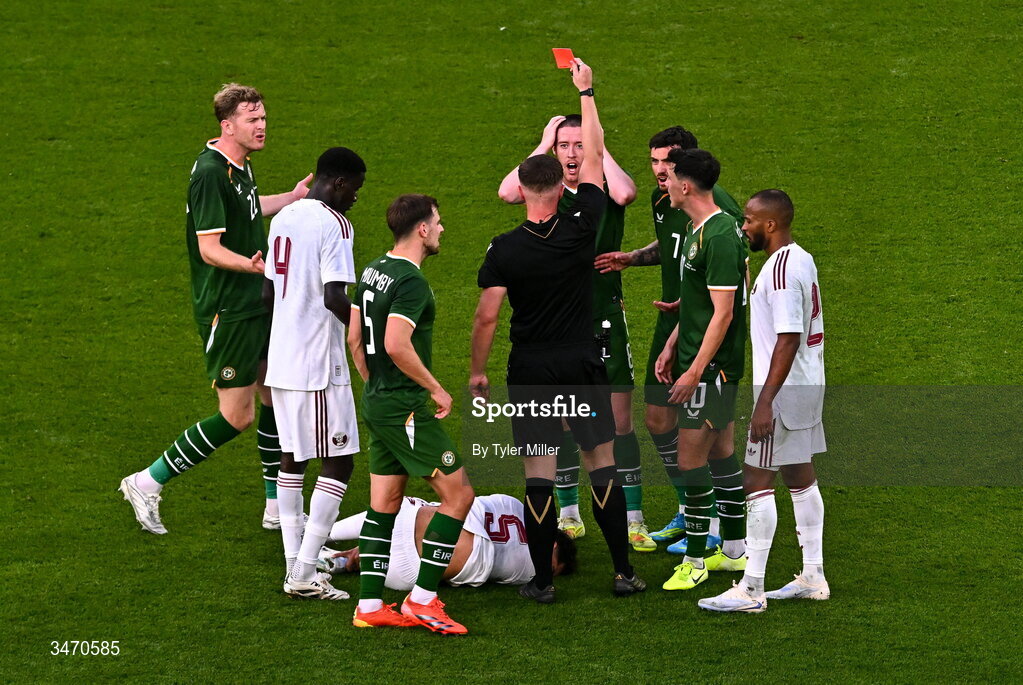 28 May 2026; Jack Moylan of Republic of Ireland reacts as referee Jamie Robinson shows him a red card during the international friendly match between Republic of Ireland and Qatar at the Aviva Stadium in Dublin. Photo by Tyler Miller/Sportsfile