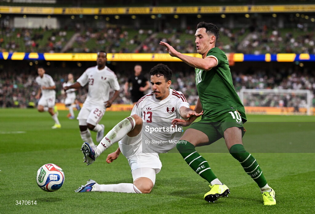 28 May 2026; Assim Madibo of Qatar in action against Jamie McGrath of Republic of Ireland during the international friendly match between Republic of Ireland and Qatar at the Aviva Stadium in Dublin. Photo by Stephen McCarthy/Sportsfile