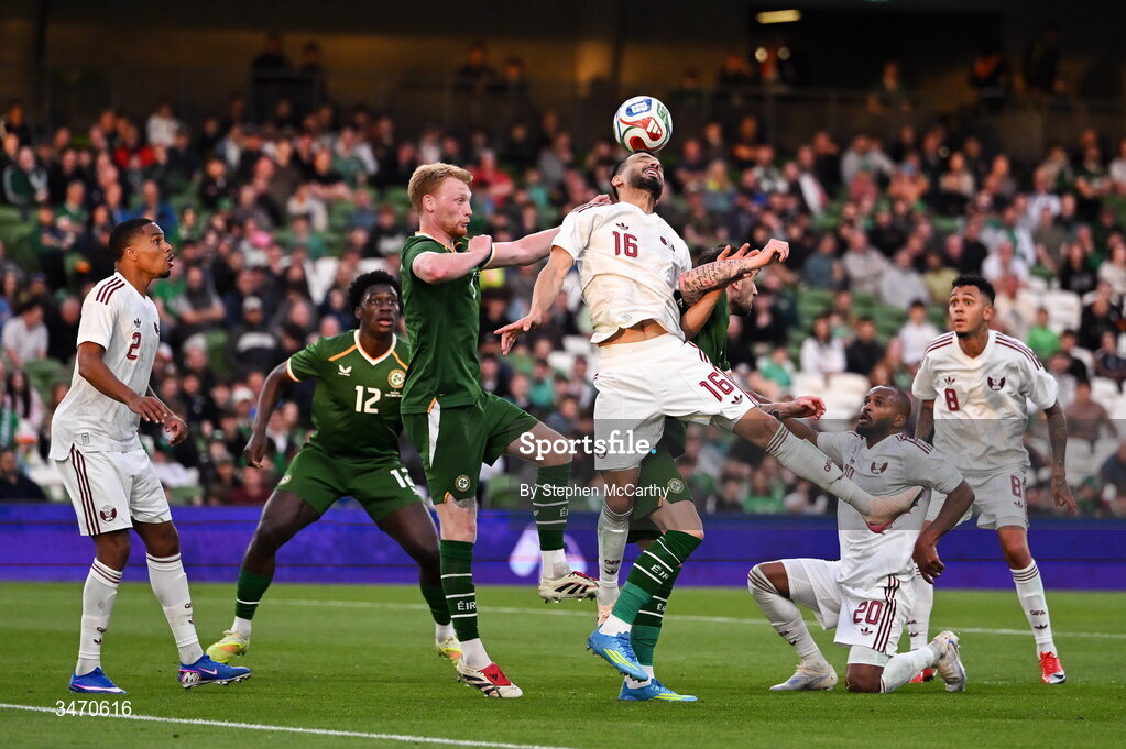 28 May 2026; Boualem Khoukhi of Qatar in action against Republic of Ireland players Liam Scales, left, and Troy Parrott during the international friendly match between Republic of Ireland and Qatar at the Aviva Stadium in Dublin. Photo by Stephen McCarthy/Sportsfile