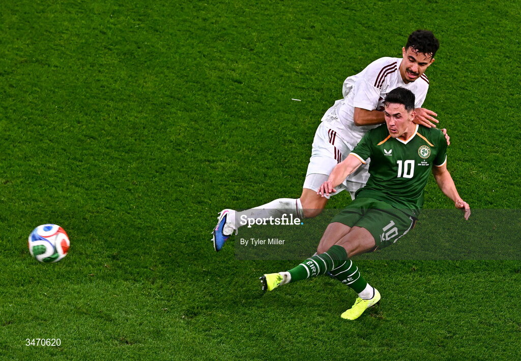 28 May 2026; Jamie McGrath of Republic of Ireland is tackled by Ayoub Al-Oui of Qatar during the international friendly match between Republic of Ireland and Qatar at the Aviva Stadium in Dublin. Photo by Tyler Miller/Sportsfile
