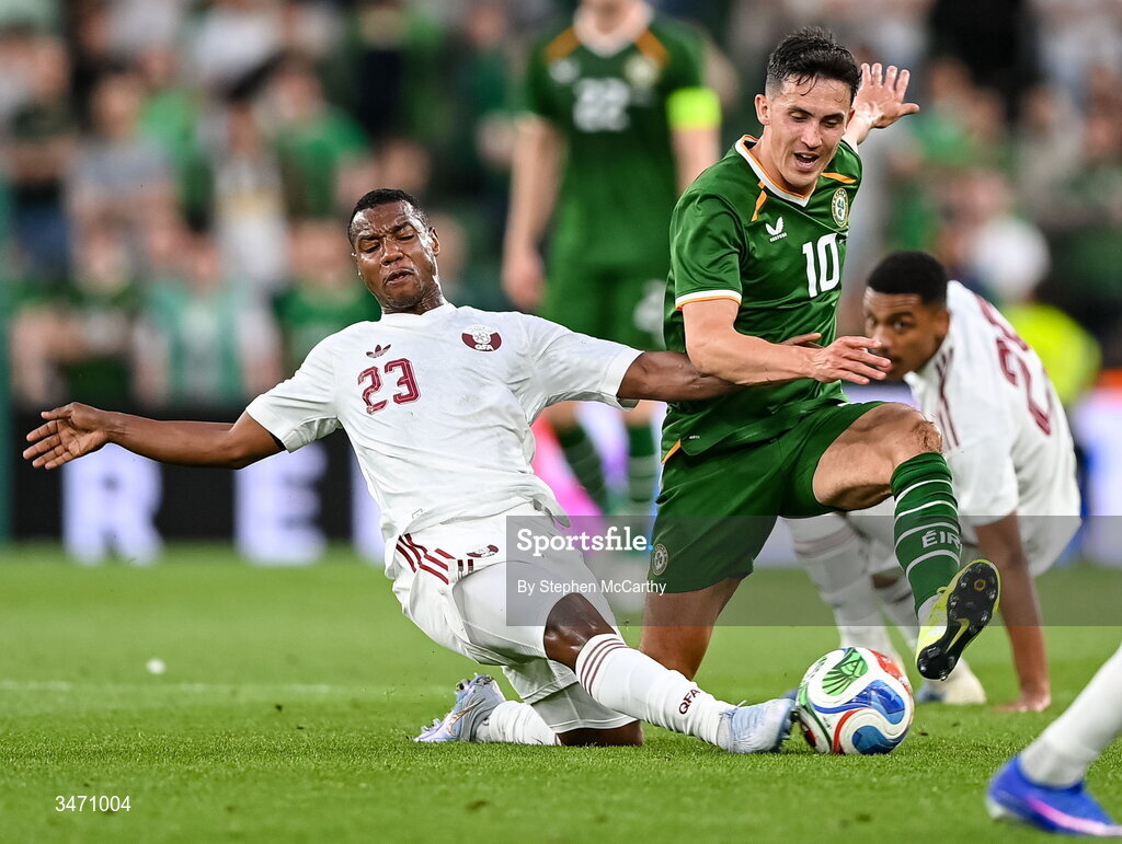 28 May 2026; Jamie McGrath of Republic of Ireland is tackled by Assim Madibo of Qatar during the international friendly match between Republic of Ireland and Qatar at the Aviva Stadium in Dublin. Photo by Stephen McCarthy/Sportsfile