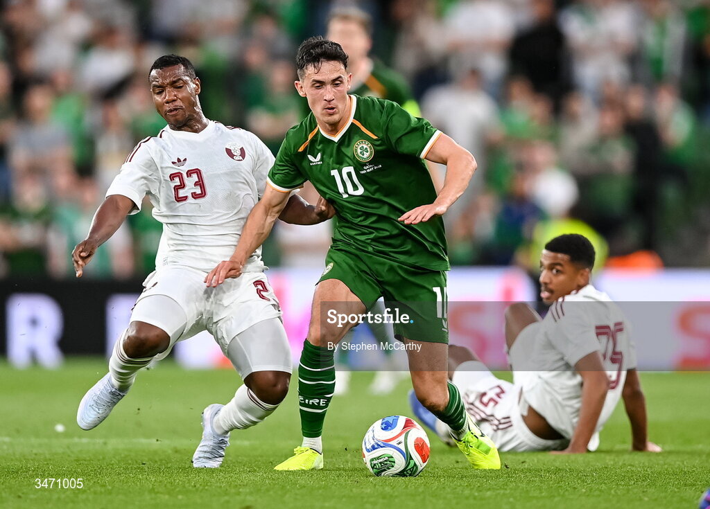 28 May 2026; Jamie McGrath of Republic of Ireland is tackled by Assim Madibo of Qatar during the international friendly match between Republic of Ireland and Qatar at the Aviva Stadium in Dublin. Photo by Stephen McCarthy/Sportsfile