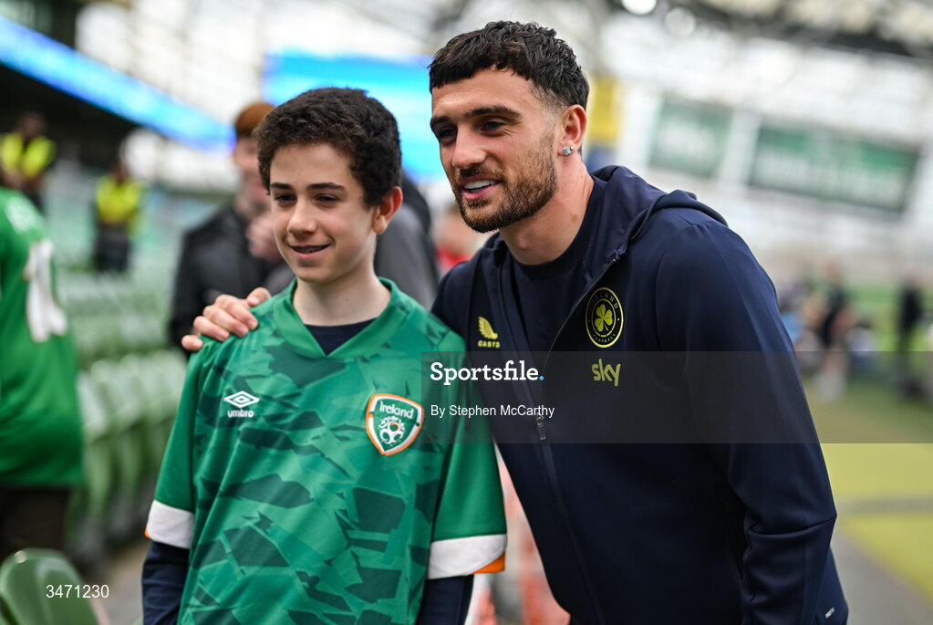 28 May 2026; Troy Parrott of Republic of Ireland poses for a photograph with a supporter before the international friendly match between Republic of Ireland and Qatar at the Aviva Stadium in Dublin. Photo by Stephen McCarthy/Sportsfile