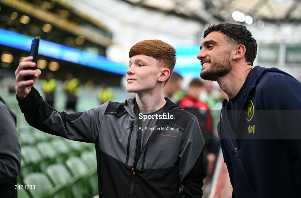 28 May 2026; Troy Parrott of Republic of Ireland poses for a photograph with a supporter before the international friendly match between Republic of Ireland and Qatar at the Aviva Stadium in Dublin. Photo by Stephen McCarthy/Sportsfile