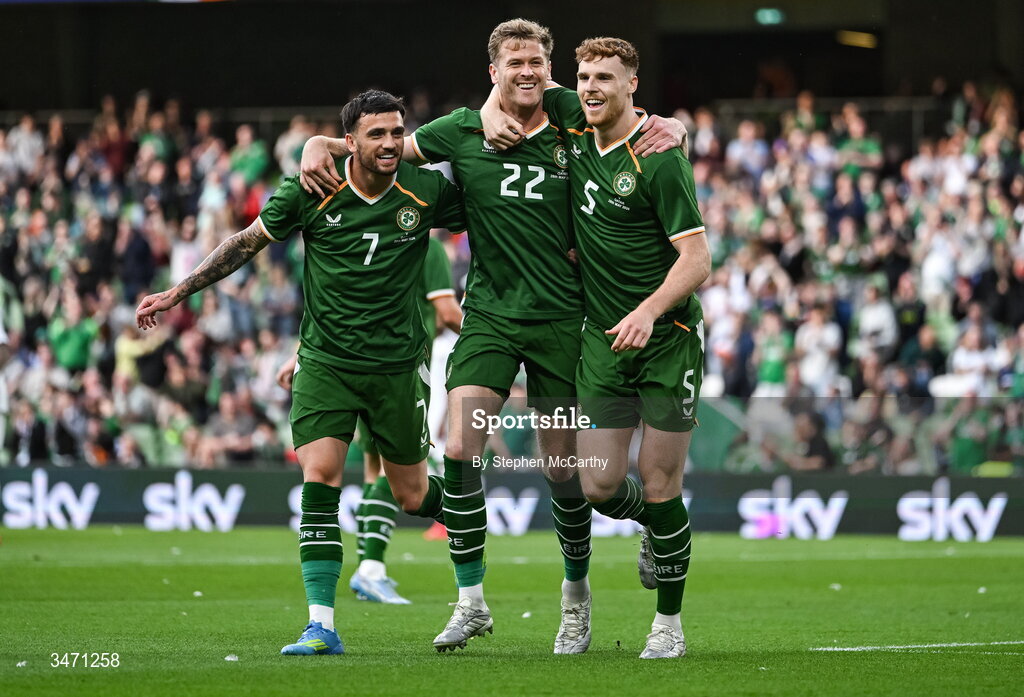 28 May 2026; Nathan Collins of Republic of Ireland, centre, celebrates with teammates Troy Parrott, left, and Jake O'Brien after scoring their side's first goal during the international friendly match between Republic of Ireland and Qatar at the Aviva Stadium in Dublin.  Photo by Stephen McCarthy/Sportsfile