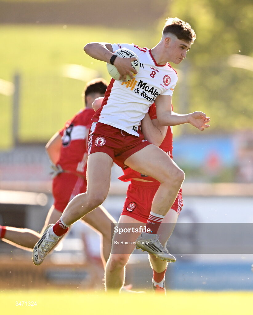 29 May 2026; Tomas Gallen of Tyrone in action against Jarlath McCartney of Derry during the Electric Ireland Ulster GAA Football Minor Championship final match between Derry and Tyrone at O'Donnell Park in Letterkenny, Donegal. Photo by Ramsey Cardy/Sportsfile