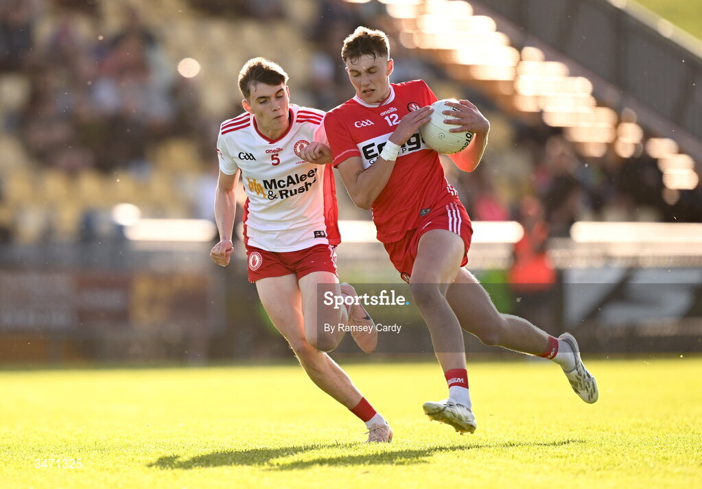 29 May 2026; Neil McDermott of Derry in action against Matthew J Daly of Tyrone during the Electric Ireland Ulster GAA Football Minor Championship final match between Derry and Tyrone at O'Donnell Park in Letterkenny, Donegal. Photo by Ramsey Cardy/Sportsfile