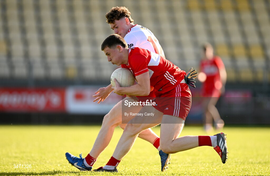 29 May 2026; Jarlath McCartney of Derry in action against Ruairi O'Neill of Tyrone during the Electric Ireland Ulster GAA Football Minor Championship final match between Derry and Tyrone at O'Donnell Park in Letterkenny, Donegal. Photo by Ramsey Cardy/Sportsfile