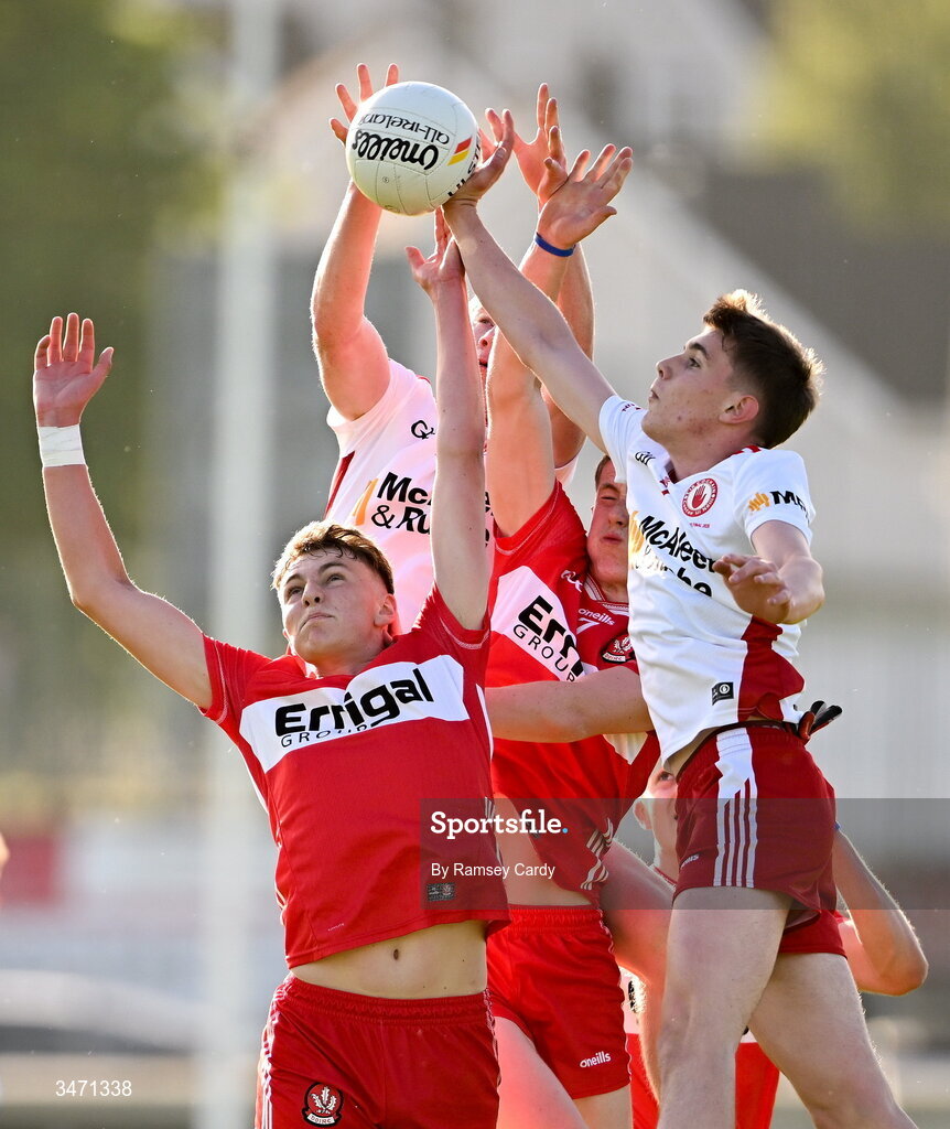 29 May 2026; Neil McDermott and Jarlath McCartney of Derry in action against Charlie Meenan and Matthew J Daly of Tyrone during the Electric Ireland Ulster GAA Football Minor Championship final match between Derry and Tyrone at O'Donnell Park in Letterkenny, Donegal. Photo by Ramsey Cardy/Sportsfile