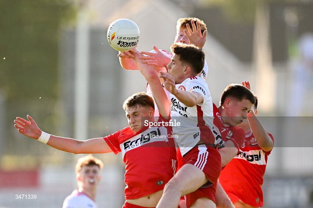 29 May 2026; Neil McDermott and Jarlath McCartney of Derry in action against Charlie Meenan and Matthew J Daly of Tyrone during the Electric Ireland Ulster GAA Football Minor Championship final match between Derry and Tyrone at O'Donnell Park in Letterkenny, Donegal. Photo by Ramsey Cardy/Sportsfile