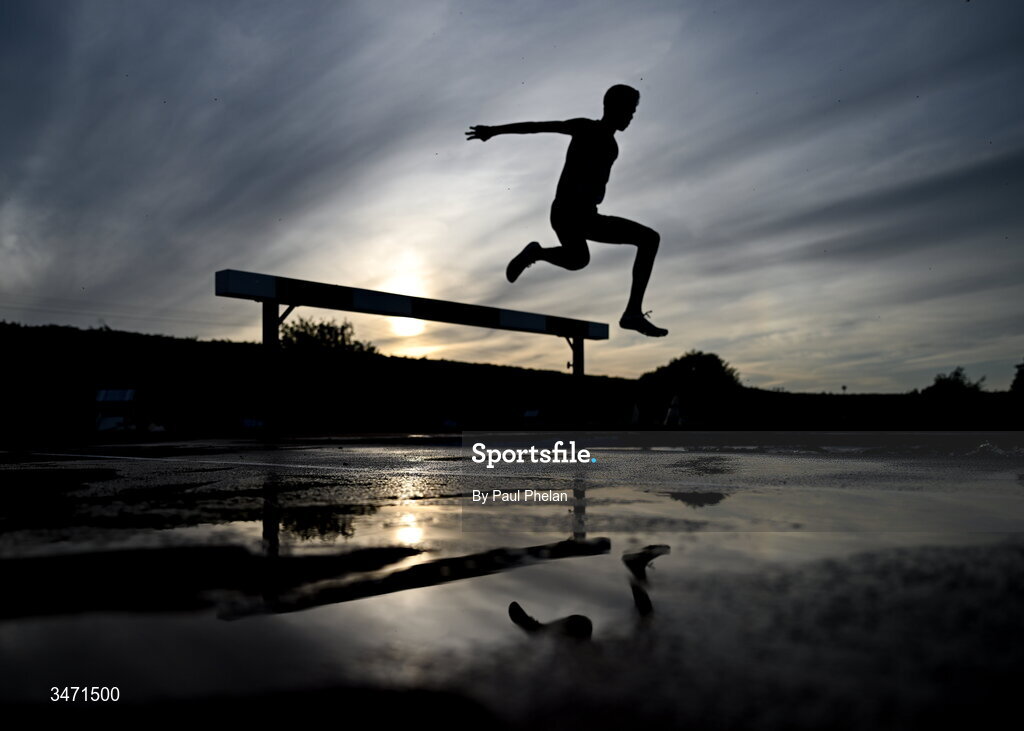 29 May 2026; An athlete, silhoutted against the sky, competing in the senior boys 2000m steeplechase during day one of the 123.ie All-Ireland Schools' Track and Field Championships at Tullamore Harriers Athletics Club in Offaly. Photo by Paul Phelan/Sportsfile