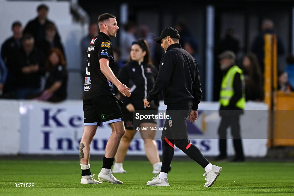 29 May 2026; Derry City manager Tiernan Lynch makes his way off the pitch past Patrick McClean of Derry City, left, after the SSE Airtricity Men’s Premier Division match between Dundalk and Derry City at Oriel Park in Dundalk, Louth. Photo by Ben McShane/Sportsfile
