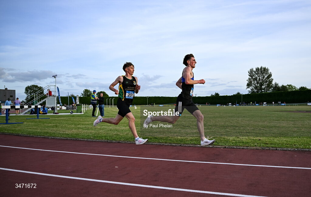 29 May 2026; Diarmuid Moloney of Nenagh CBS, Tipperary, and Lucas Lyons of St.Clare's Comprehensive Manorhamilton, Leitrim, competing in the senior boys 5000m  during day one of the 123.ie All-Ireland Schools' Track and Field Championships at Tullamore Harriers Athletics Club in Offaly. Photo by Paul Phelan/Sportsfile