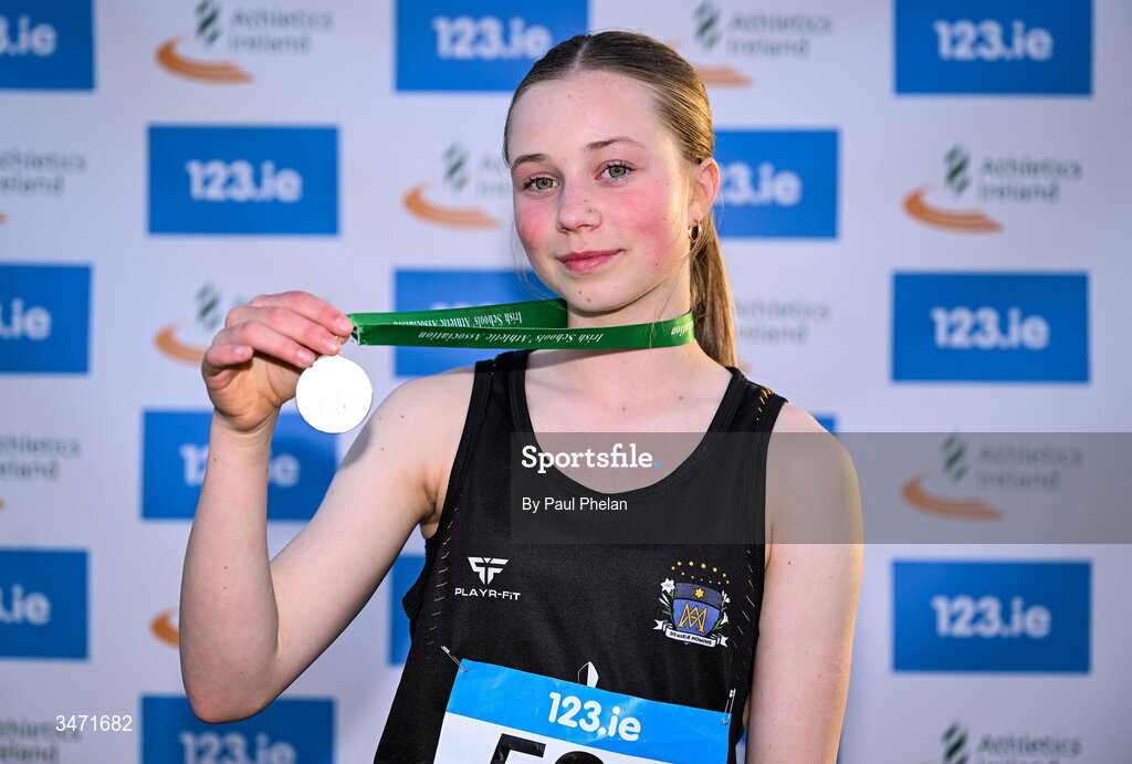 29 May 2026;  Autumn Moran of St. Marys Dundalk, Louth holds up her gold medal after winning the minor girls high jump  during day one of the 123.ie All-Ireland Schools' Track and Field Championships at Tullamore Harriers Athletics Club in Offaly. Photo by Paul Phelan/Sportsfile