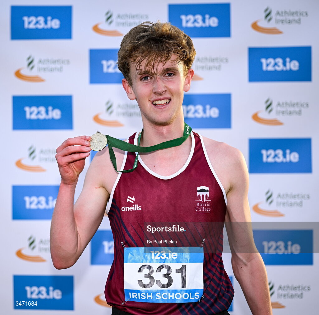 29 May 2026; Tom Murphy of Borris College, Carlow, holds up his gold medal after winning the senior boys 2000m steeplechase during day one of the 123.ie All-Ireland Schools' Track and Field Championships at Tullamore Harriers Athletics Club in Offaly. Photo by Paul Phelan/Sportsfile