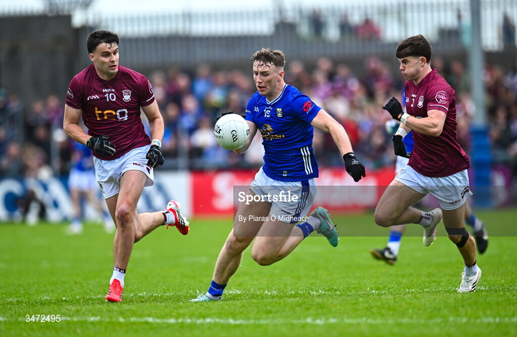 30 May 2026; Patrick Lynch of Cavan in action against Kevin O'Sullivan, left, and Daniel Scahill of Westmeath during the GAA Football All-Ireland Senior Championship Round 1 match between Westmeath and Cavan at TEG Cusack Park in Mullingar, Westmeath. Photo by Piaras Ó Mídheach/Sportsfile