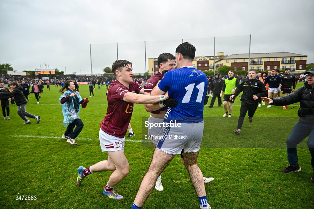 30 May 2026; Westmeath players Shane Corcoran, left, and Daniel Scahill and Ryan Donohoe of Cavan tussle after the match at the GAA Football All-Ireland Senior Championship Round 1 match between Westmeath and Cavan at TEG Cusack Park in Mullingar, Westmeath. Photo by Piaras Ó Mídheach/Sportsfile