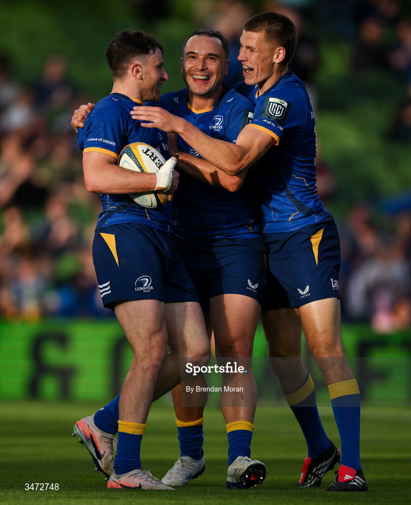 30 May 2026; Hugo Keenan of Leinster, left, celebrates with teammate James Lowe, centre, and Sam Prendergast after scoring their side's second try during the United Rugby Championship quarter-final match between Leinster and Lions at the Aviva Stadium in Dublin. Photo by Brendan Moran/Sportsfile