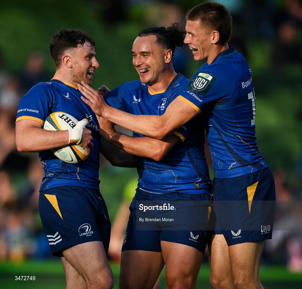 30 May 2026; Hugo Keenan of Leinster, left, celebrates with teammate James Lowe, centre, and Sam Prendergast after scoring their side's second try during the United Rugby Championship quarter-final match between Leinster and Lions at the Aviva Stadium in Dublin. Photo by Brendan Moran/Sportsfile