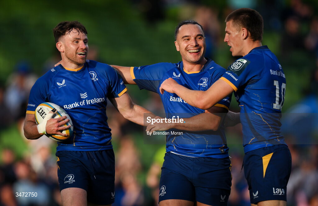 30 May 2026; Hugo Keenan of Leinster, left, celebrates with teammate James Lowe, centre, and Sam Prendergast after scoring their side's second try during the United Rugby Championship quarter-final match between Leinster and Lions at the Aviva Stadium in Dublin. Photo by Brendan Moran/Sportsfile