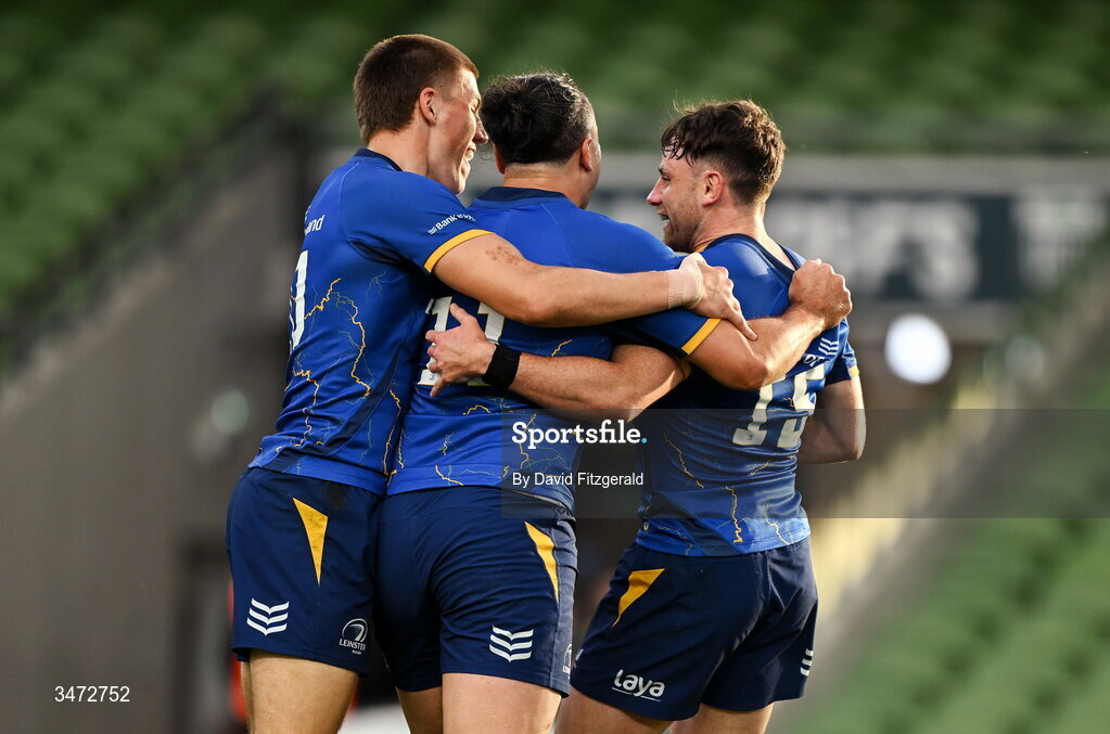 30 May 2026; Hugo Keenan of Leinster, right, celebrates with teammates Sam Prendergast, left, and James Lowe after scoring their side's second try during the United Rugby Championship quarter-final match between Leinster and Lions at the Aviva Stadium in Dublin. Photo by David Fitzgerald/Sportsfile